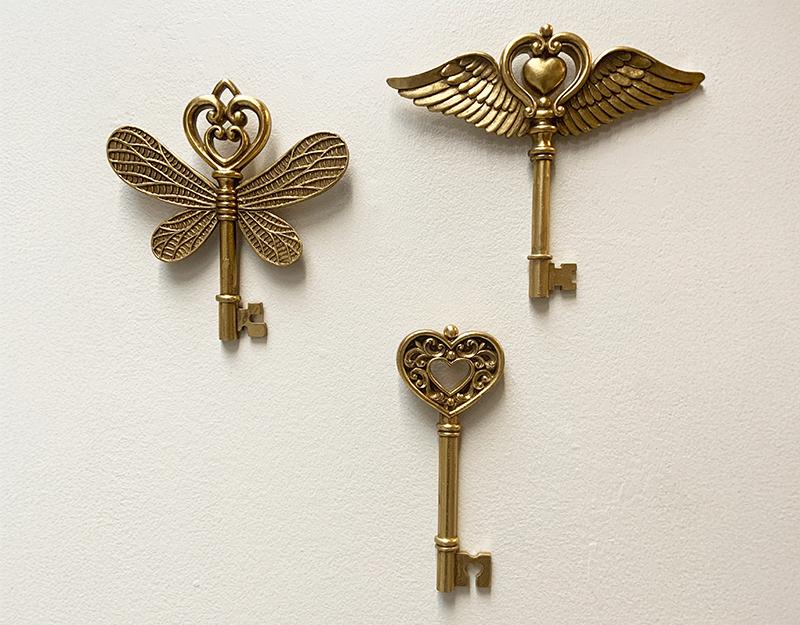 Photo n°3 du produit Déco murale clé ailes doré 16x17.3cm-481T17-0