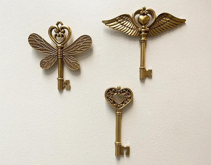 Photo n°3 du produit Déco murale clé ailes doré 16x17.3cm-481T17-0